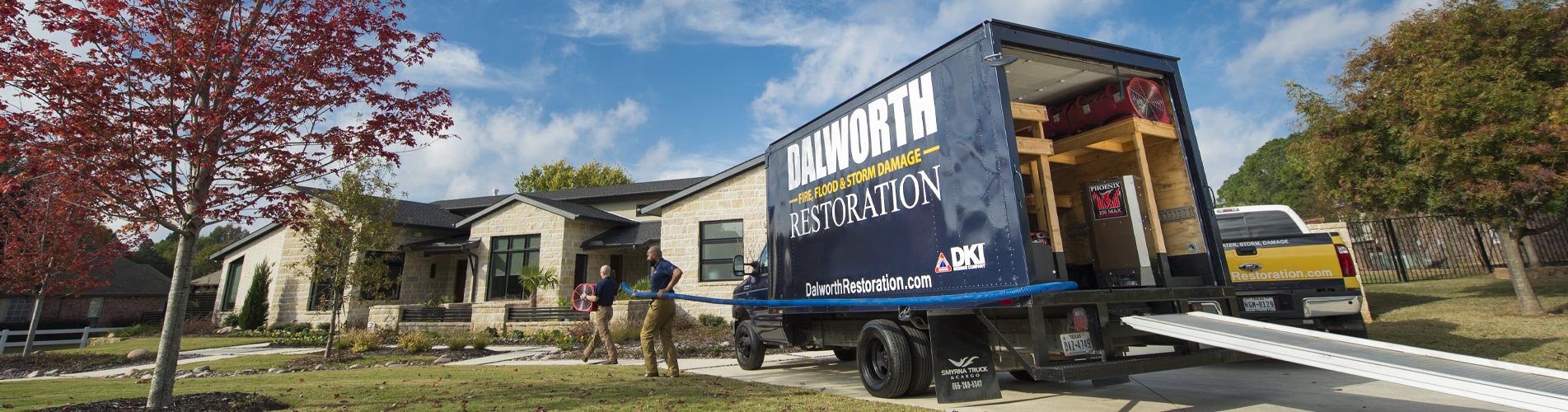 Dalworth Restoration's Truck and Crew members working on a restoration site